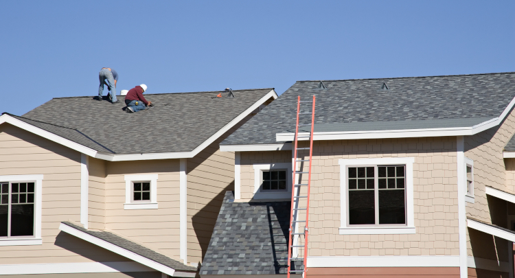 Crew Replacing Asphalt Roof